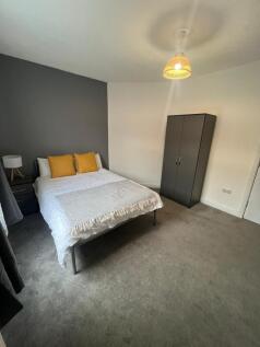 A modern double bedroom featuring a comfortable...