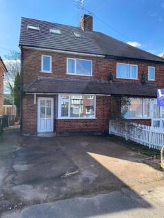 Charming semi-detached house exterior with a sp...