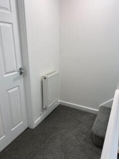 A clean and well-maintained hallway featuring n...