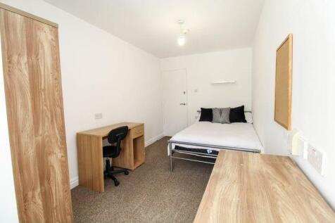 Bright and tidy double bedroom featuring a comf...