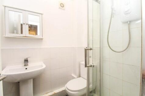 A clean and functional bathroom featuring a ped...