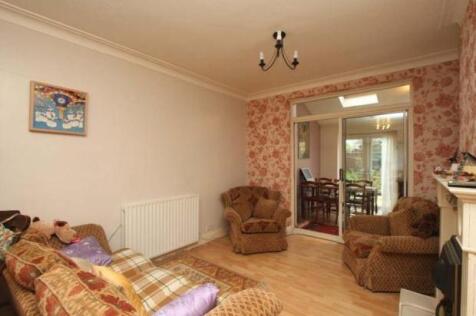A cozy living room featuring comfortable armcha...
