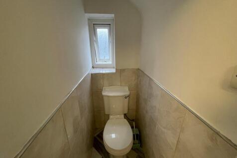 A clean and well-maintained single toilet area ...