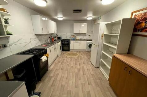 A spacious, well-organized kitchen featuring mo...