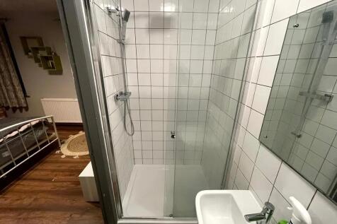 A clean and modern bathroom featuring a spaciou...