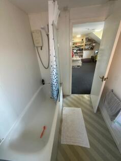 Bright and functional bathroom suite featuring ...