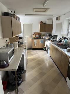 A spacious kitchen with ample counter space, re...