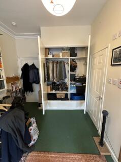 A well-organized small storage area with ample ...