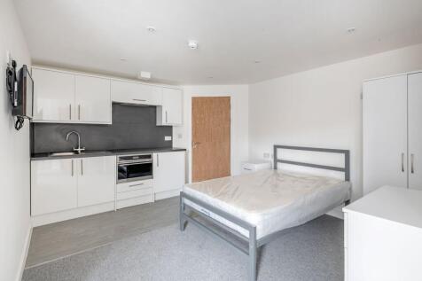 Bright and modern double bedroom featuring a sl...