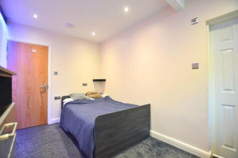A cozy double bedroom featuring a comfortable d...