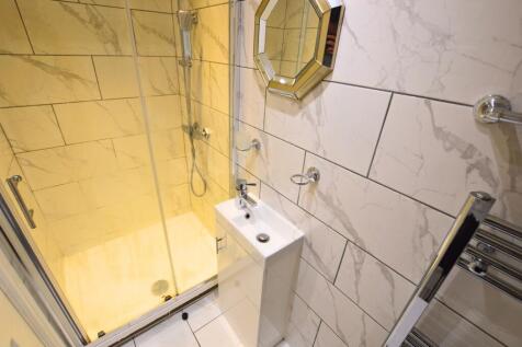 Bright and modern bathroom featuring stylish ma...