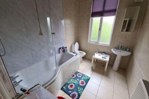 Bright and well-maintained bathroom featuring a...