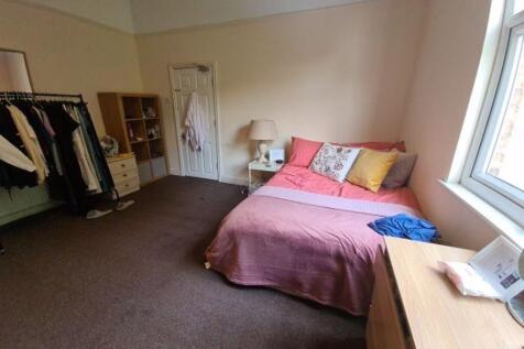 Bright and cozy double bedroom featuring a larg...