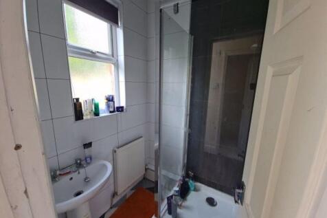 A clean and functional bathroom featuring a bri...