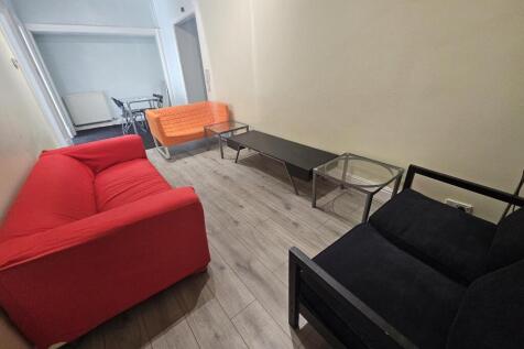 A modern and cozy living room featuring a vibra...