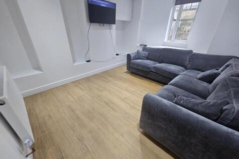 A bright and modern living room featuring a com...