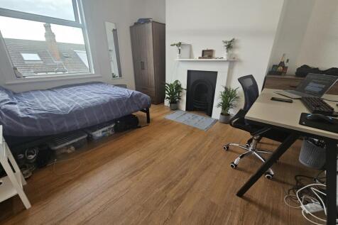 A bright and spacious living room with natural ...