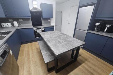 Modern and well-maintained kitchen with ample c...