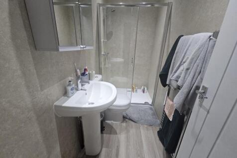 A clean and well-maintained bathroom featuring ...