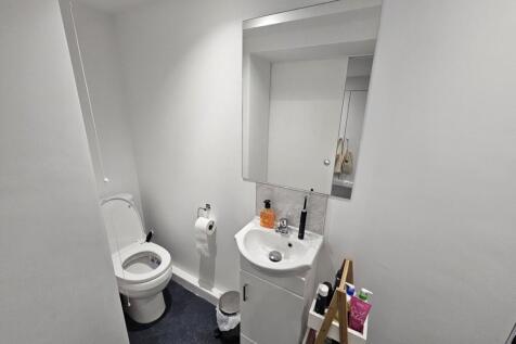 A spacious and modern bathroom featuring a larg...