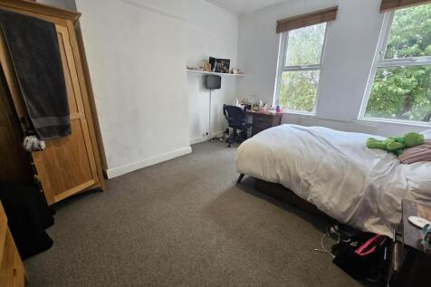 A spacious and well-maintained master bedroom f...