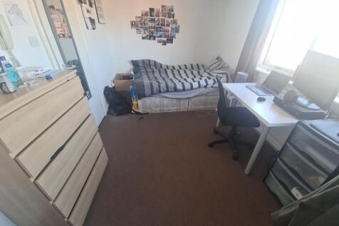 A well-sized, inviting living room featuring a ...