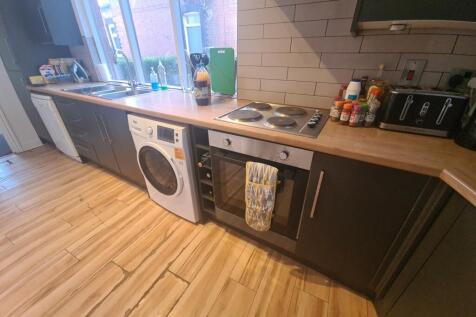 A well-maintained kitchen area featuring modern...