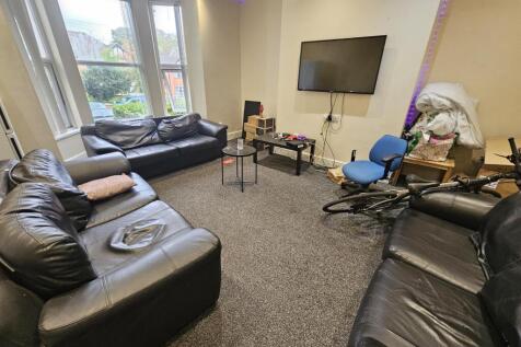 A spacious and well-maintained living room feat...