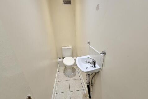 A clean and functional bathroom featuring a toi...