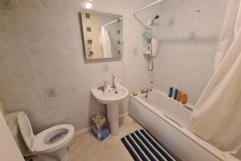 A clean and well-maintained bathroom with a bat...