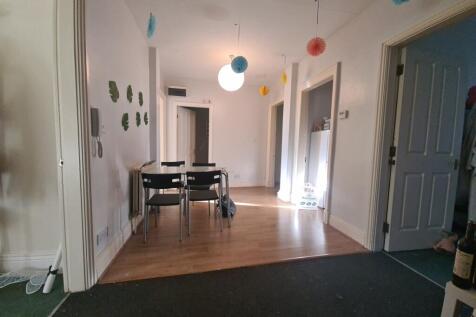 A spacious and welcoming living area with ample...