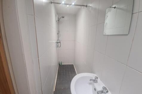 A clean and well-maintained bathroom with a spa...