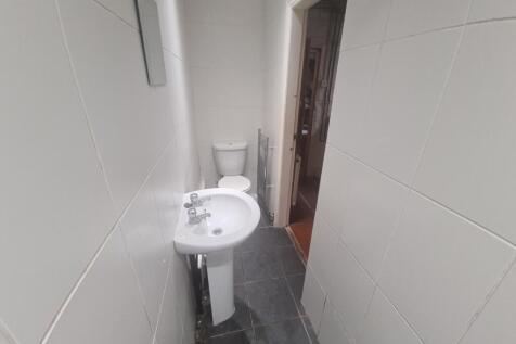 A clean and functional bathroom with a toilet a...