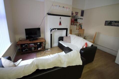 A comfortable and well-lit living room with mod...