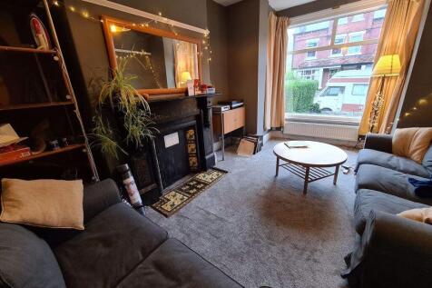 A cozy and inviting living room featuring comfo...