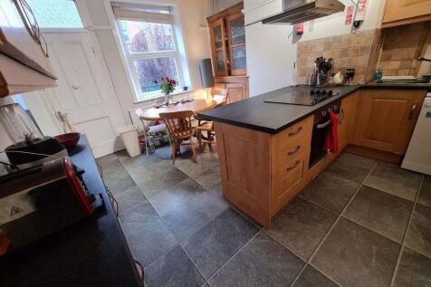 A well-maintained kitchen with ample workspace,...