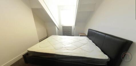 Bright attic double bedroom with sloped ceiling...