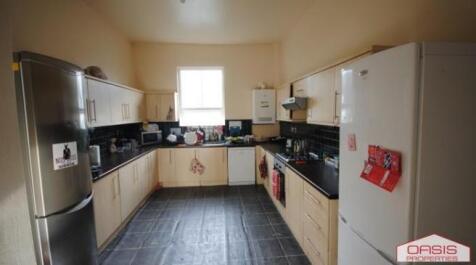 Bright, modern galley-style kitchen with light ...