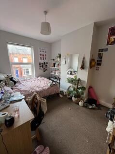 Bright, well-lit double bedroom with a large wi...