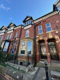 Attractive red-brick terraced property with bay...