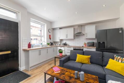 Bright open-plan living area with a modern fitt...