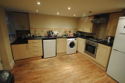 Modern fitted kitchen with a full set of applia...