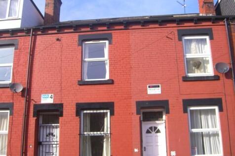 Red-brick terraced house with a neat frontage, ...