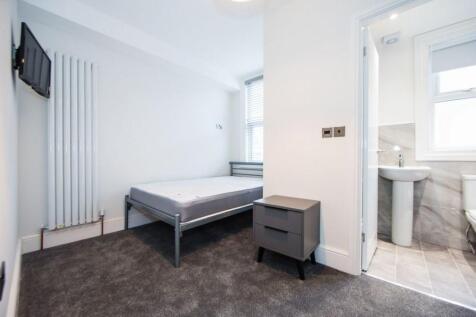 Bright, freshly decorated bedroom with neutral ...