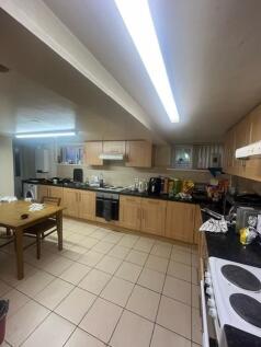 Spacious communal kitchen with long run of fitt...