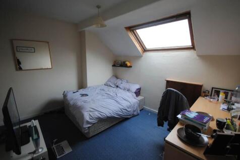 Bright double bedroom in a converted loft with ...