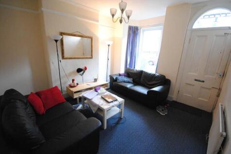 Bright, neatly presented living room with two c...
