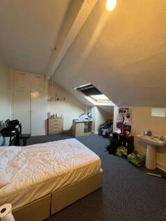 Bright attic double bedroom with sloped ceiling...