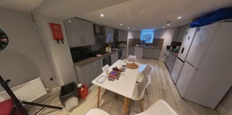 Bright, modern open-plan kitchen with a dining ...