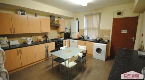 Bright, modern kitchen with ample cabinetry, in...